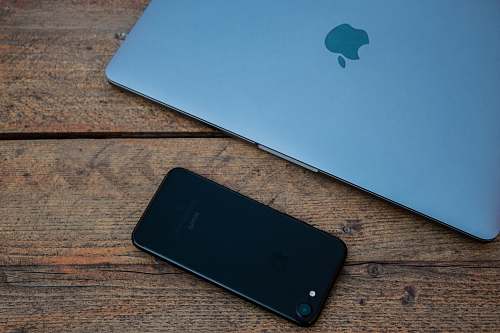 electronics jet black iPhone 7 on brown wooden surface mobile phone